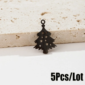 Detail of black stainless steel cutout Christmas tree pendant with star patterns