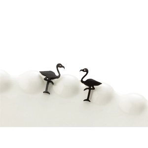 Minimalist black flamingo stainless steel stud earrings on a white textured background