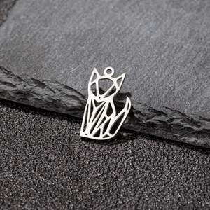 Macro shot of silver origami fox pendant in minimalist geometric hollow design