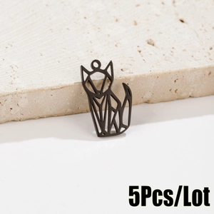 Close-up of matte black hollow origami fox pendant charms for DIY jewelry making