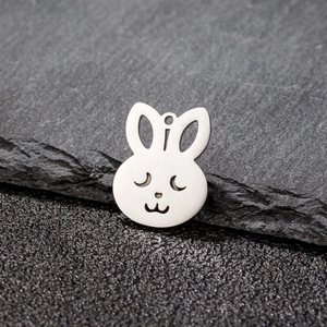 Macro view of a hollow rabbit head pendant with polished silver stainless steel finish