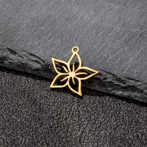 Hollow gold flower pendant with five petals on a dark stone background for jewelry making