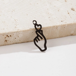 Detail of black heart hand gesture pendant in stainless steel with matte finish
