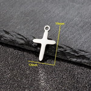 Minimalist stainless steel cross pendant with brushed finish measuring 19mm by 12mm