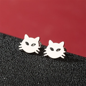 Close-up of polished silver cat ear studs featuring a cute hollowed-out feline design