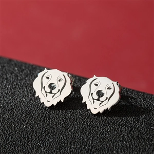 Polished stainless steel Golden Retriever dog head stud earrings on a bold red background