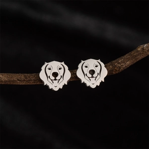 Polished silver golden retriever dog stud earrings displayed on a natural branch
