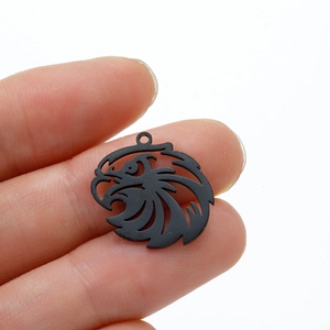 Detailed close-up of matte black eagle pendant with hollow outline for jewelry making