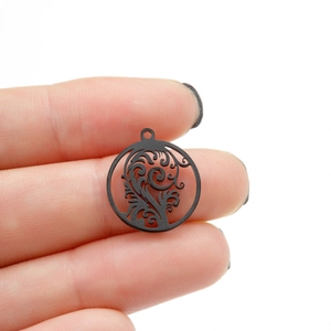 Black stainless steel tree of life circular pendant with intricate laser cut floral pattern