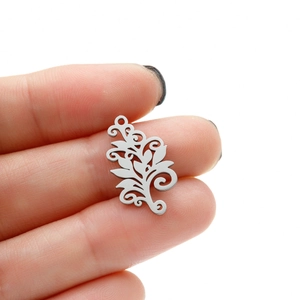 Bohemian Tree of Life stainless steel pendant charm held by hand for DIY jewelry making