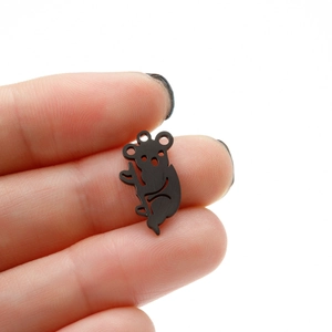 Macro shot of a small black stainless steel koala charm pendant for DIY jewelry making