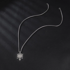 Polished stainless steel necklace featuring a double-headed eagle pendant on black leather