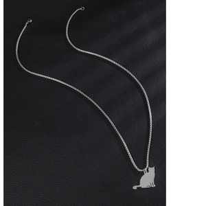 Sitting cat pendant necklace in polished silver stainless steel on black leather background