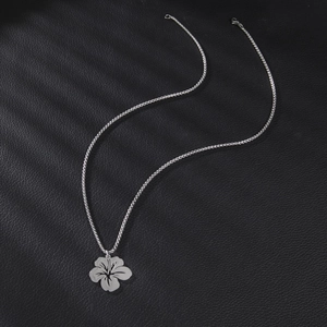 Silver flower pendant necklace with elegant hollow lines on black textured leather