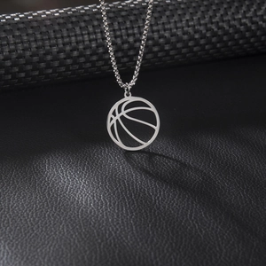 Minimalist silver stainless steel hollow basketball pendant necklace on leather background
