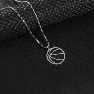 Silver basketball pendant necklace in stainless steel on black leather background