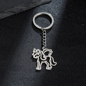 Polished silver stainless steel keychain with hollow unicorn pendant on a black stone base