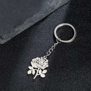 Minimalist silver stainless steel keychain featuring a hollow-out rose flower pendant