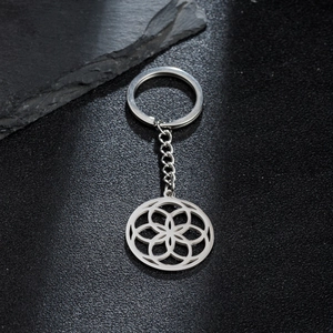 Minimalist stainless steel keychain with hollow geometric floral pendant and silver finish