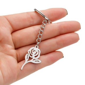 Silver stainless steel rose flower keychain featuring a hollowed-out floral pendant design
