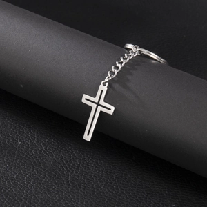 Polished stainless steel hollow cross pendant keychain with a minimalist silver finish