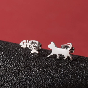 Minimalist asymmetric cat and fishbone stud earrings in polished silver steel