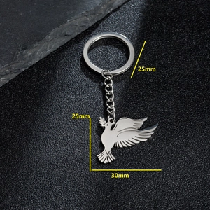 Polished silver dove pendant keychain in stainless steel with detailed feather texture