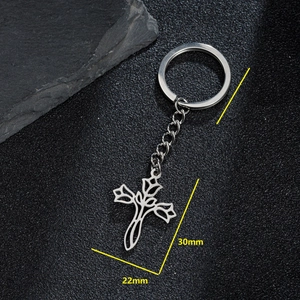 Stainless steel rose flower cross keychain pendant on rock background, 30mm x 22mm size