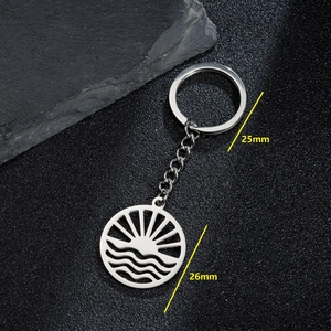 Stainless steel sunrise and mountain keychain featuring hollow design 26mm diameter