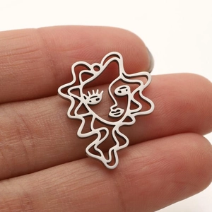 Minimalist silver stainless steel abstract face pendant with hollow line art design