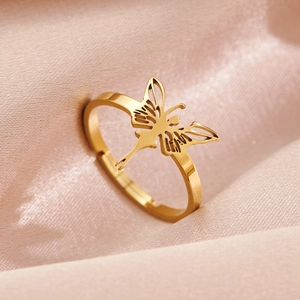 Elegant gold hollow butterfly open ring with adjustable band on satin background