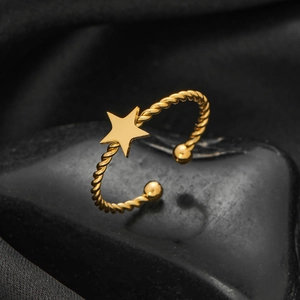 Golden twisted open ring featuring a minimalist star and polished metal bead details
