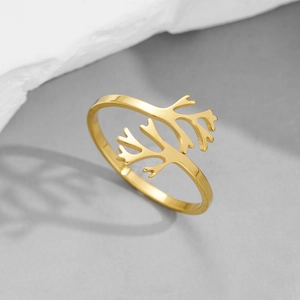Detail of golden adjustable ring featuring a unique branch coral texture and metal shine