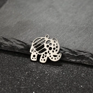 Detailed close-up of bohemian hollow elephant pendant in silver stainless steel