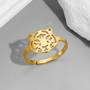 Macro shot of gold hollow tiger head ring showing adjustable open band detail