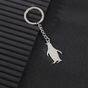 Polished silver stainless steel penguin silhouette pendant keychain with a classic metal ring