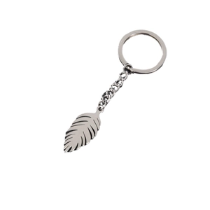 Polished stainless steel leaf pendant keychain with realistic leaf texture on white background
