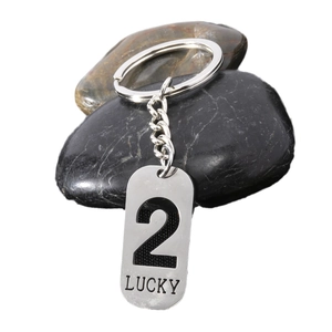 Lucky Number 2 stainless steel keychain pendant with polished finish on river stones
