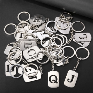 Polished stainless steel alphabet keychains with hollow letter design and metal rings