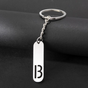 Detail of silver stainless steel keychain with rectangle tag featuring number 13 engraving