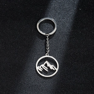 Polished stainless steel keychain featuring a hollow-out mountain peak pendant design