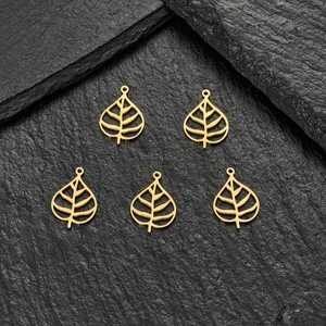 Set of 5 gold stainless steel hollow leaf pendants for DIY jewelry on dark stone