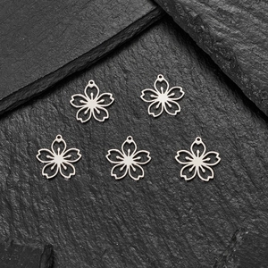 Set of five hollow cherry blossom charms in 18K gold plated stainless steel
