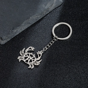 Minimalist silver stainless steel hollow crab keychain with geometric cutout design