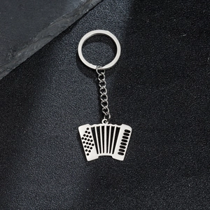 Polished silver stainless steel accordion keychain pendant on a sleek black background