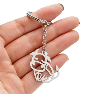 Polished stainless steel buffalo keychain with cute cartoon cutout design held in hand