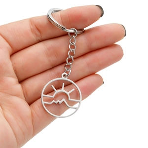 Minimalist stainless steel sunrise mountain keychain with hollow circular pendant