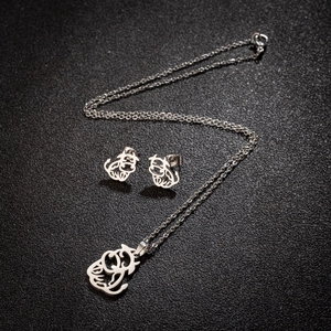 Silver stainless steel jewelry set featuring hollow bull pendant necklace and earrings