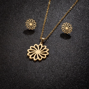 Golden flower jewelry set with hollow sunflower pendant necklace and matching stud earrings