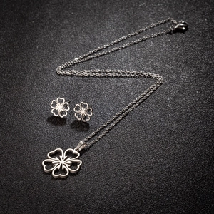 Polished silver stainless steel hollow clover necklace and stud earrings set
